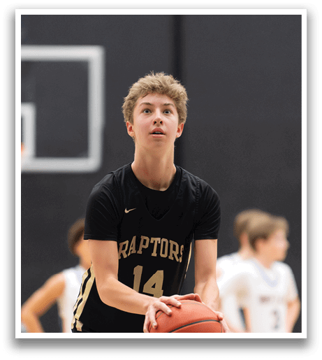 A basketball player wearing a black jersey with the number 14 on it is holding a basketball. AI generated content