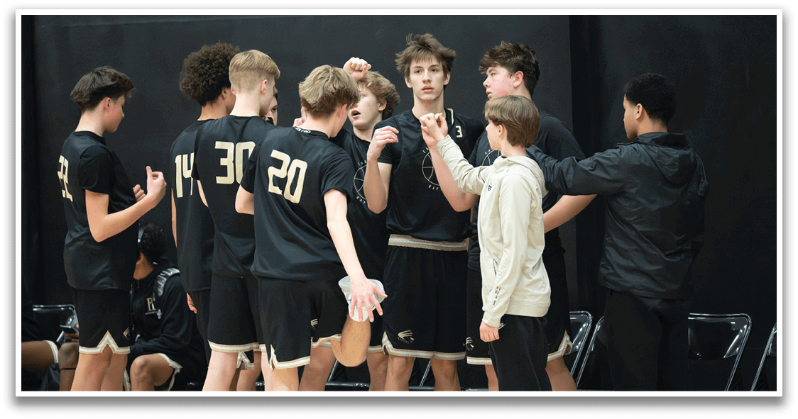 A group of young men wearing black and gold uniforms are standing in a circle, talking to each other. AI generated content