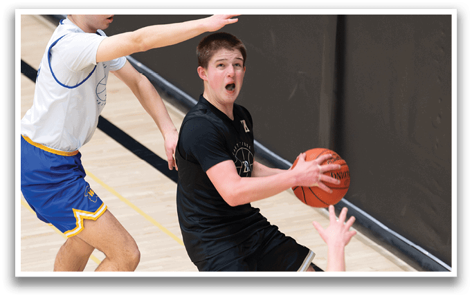 Two basketball players are on the court, one of them is trying to shoot the ball. AI generated content