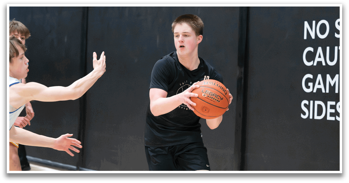 Two boys are playing basketball, one holding a basketball and the other trying to block him. AI generated content