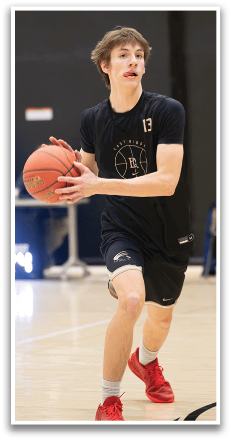 A man wearing a black shirt and red shoes is holding a basketball. AI generated content