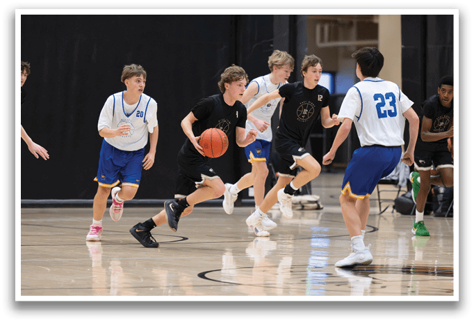 A group of young men playing basketball on a court. AI generated content