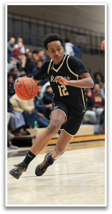 A basketball player wearing a black jersey with the number 12 on it is running with the ball. AI generated content