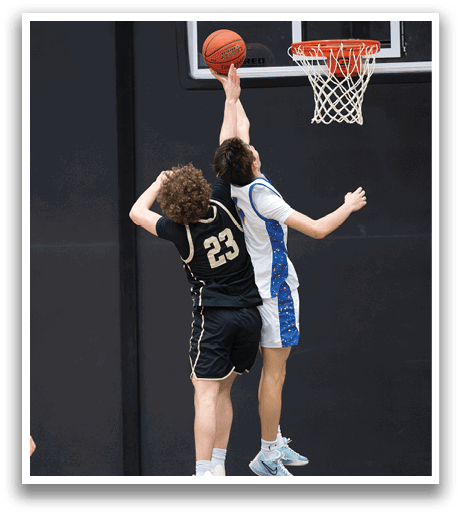Two basketball players jumping for the ball. AI generated content