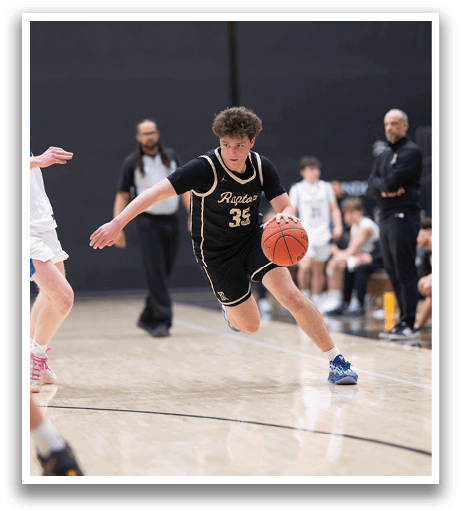Two basketball players are running on the court, one holding a basketball. AI generated content