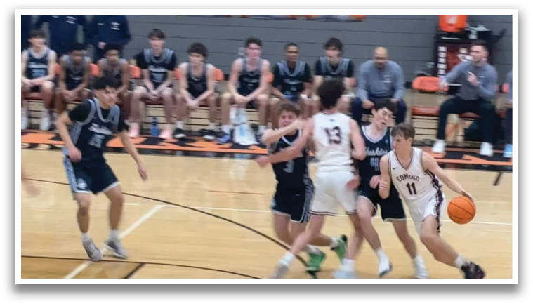 A group of young men playing basketball on a court. AI generated content