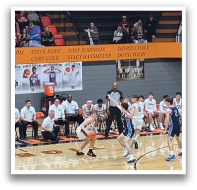 A group of men are playing basketball on a court, with one player holding his arm up. The audience watches from the stands. AI generated content