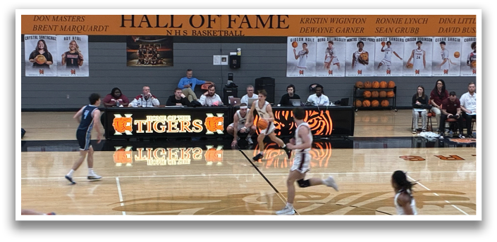 A group of people playing basketball on a court. AI generated content
