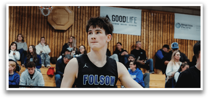 A basketball player wearing a black jersey with the number 2 on it walks across the court. AI generated content