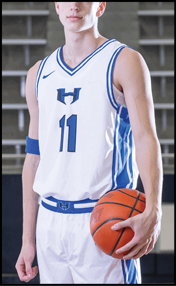 A young man wearing a basketball uniform and holding a basketball. AI generated content