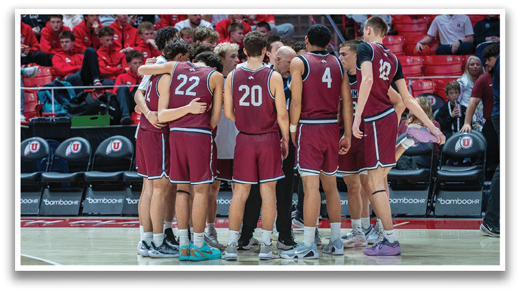 A group of men wearing red and white uniforms are huddled together on a basketball court. AI generated content