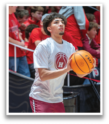 Two basketball players on a court, one holding a basketball. AI generated content