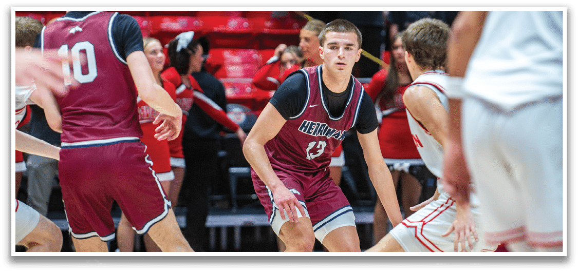 A basketball game is in progress with a player in a maroon uniform running with the ball. AI generated content