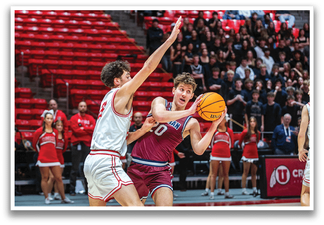Two men playing basketball on a court, one holding a basketball and the other trying to block him. AI generated content