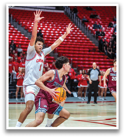 Two basketball players are playing, one with the ball and the other trying to block him. AI generated content