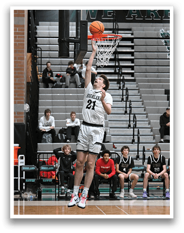 A basketball player is jumping up to catch a basketball in a gym. AI generated content