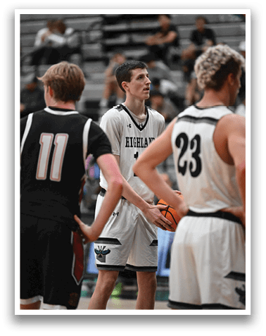 A group of men are playing basketball, with one man holding a basketball. AI generated content