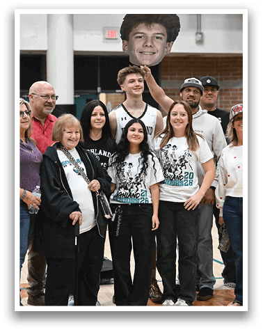 A group of people are posing for a picture on a basketball court. AI generated content