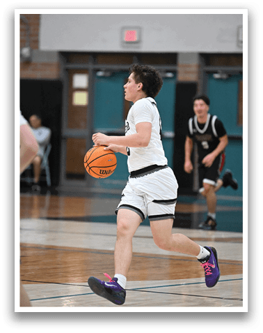 A man wearing a white shirt and black shorts is running with a basketball in his hand. AI generated content