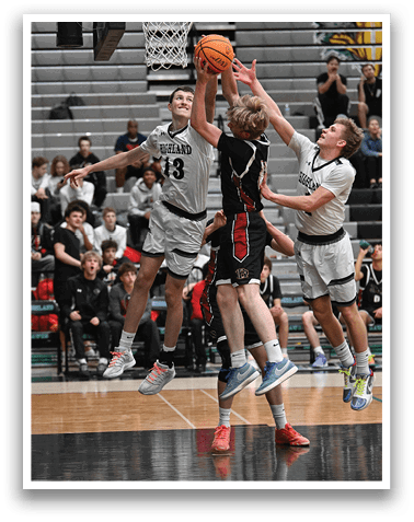 A group of men playing basketball, with one man jumping to block a shot. AI generated content