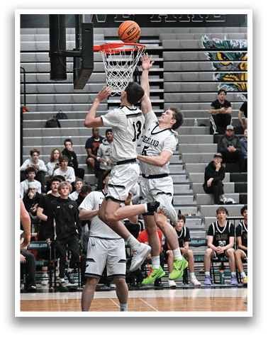 Two basketball players are leaping in the air to grab the ball. AI generated content