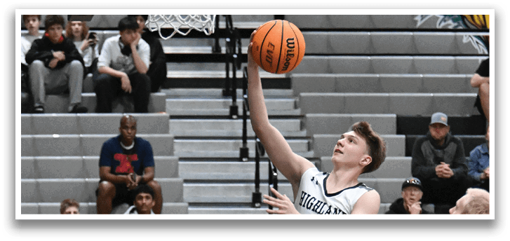 A basketball player jumps in the air to grab the ball. AI generated content