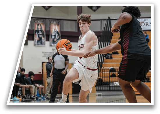 A basketball player in a white uniform is running with the ball, while another player in a red uniform tries to block him. AI generated content