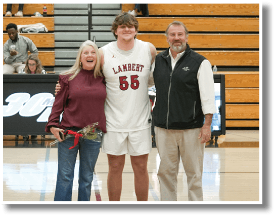 A man and woman stand on a basketball court with a man in a white jersey. AI generated content