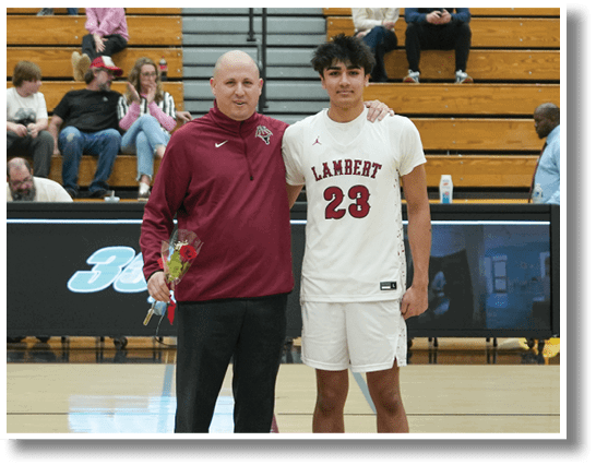 Two men stand on a basketball court, one holding a trophy. AI generated content