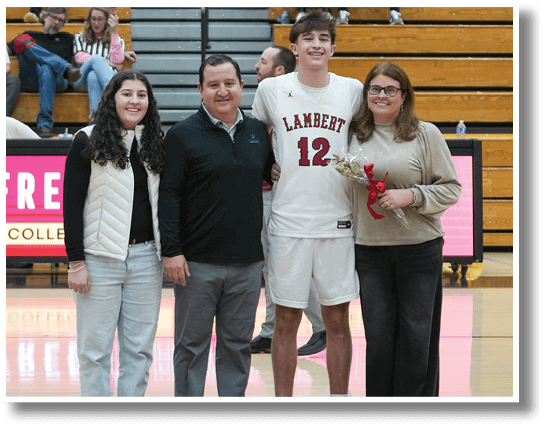 A group of people, including a man in a white jersey, pose for a picture on a basketball court. AI generated content