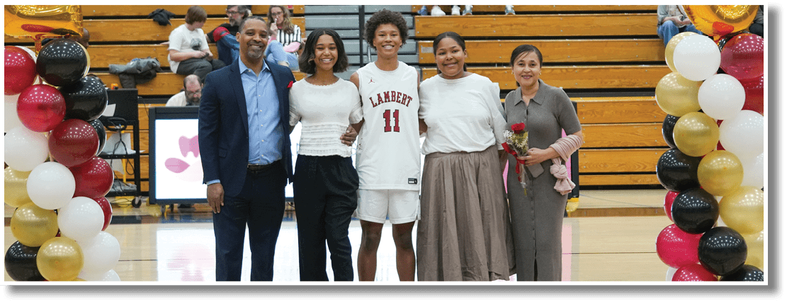 A group of people, including a man and a woman, are standing on a basketball court holding a trophy. AI generated content