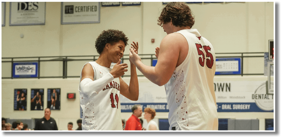 Two basketball players are hugging each other on the court. AI generated content