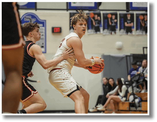 Two men playing basketball, one with a basketball in his hand. AI generated content