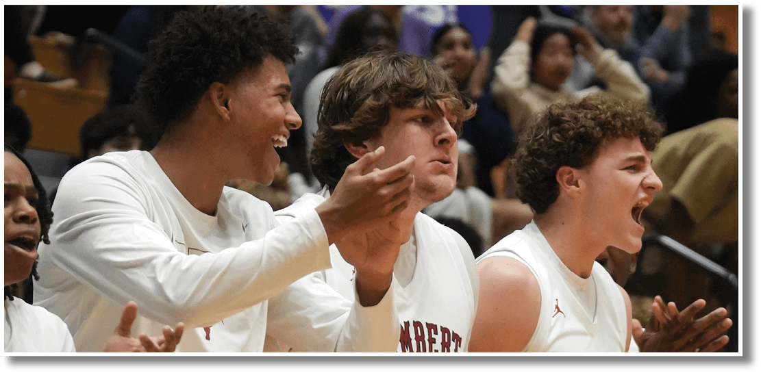 A group of young men wearing white uniforms are standing on a basketball court, with one of them holding his hands up in the air. They are likely celebrating a victory or preparing for a game. AI generated content