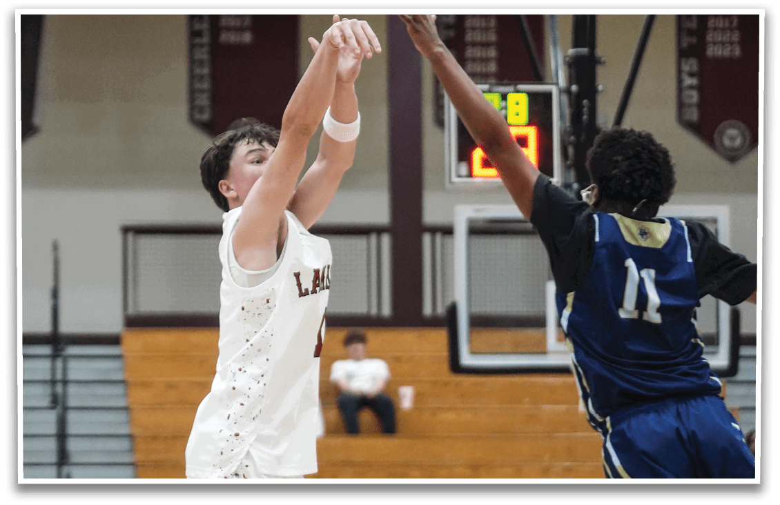 Two basketball players are in the air, one attempting to block the other's shot. AI generated content