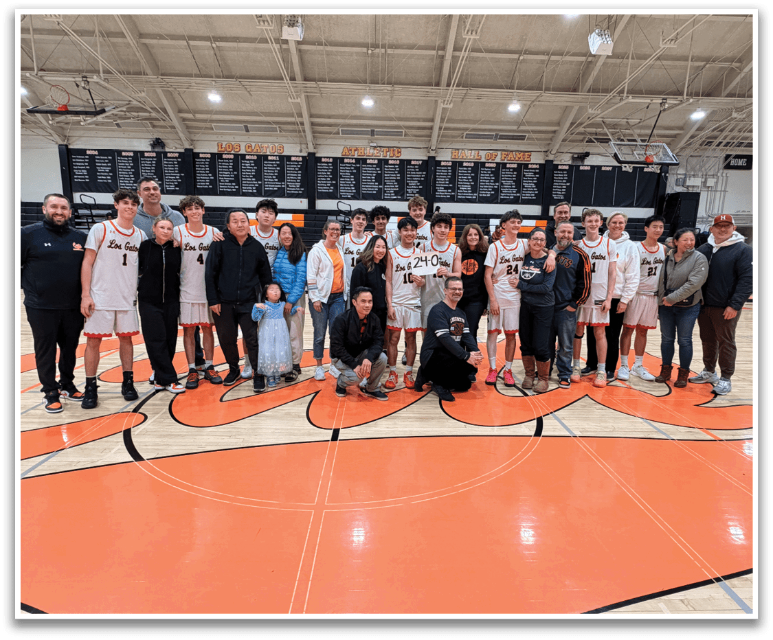 Basketball players and their coaches pose for a photo on a basketball court. AI generated content