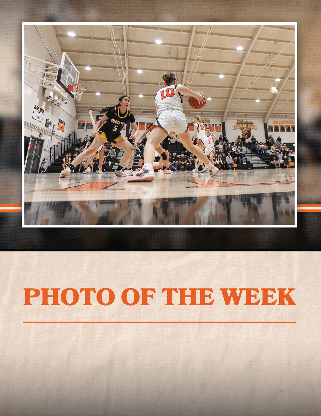A basketball game is taking place with a player in the middle of the court holding a basketball. AI generated content