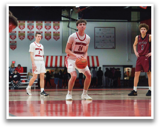 A group of young men playing basketball on a court. AI generated content