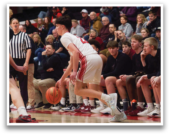 A basketball game is taking place with a player in a red jersey trying to get the ball. AI generated content