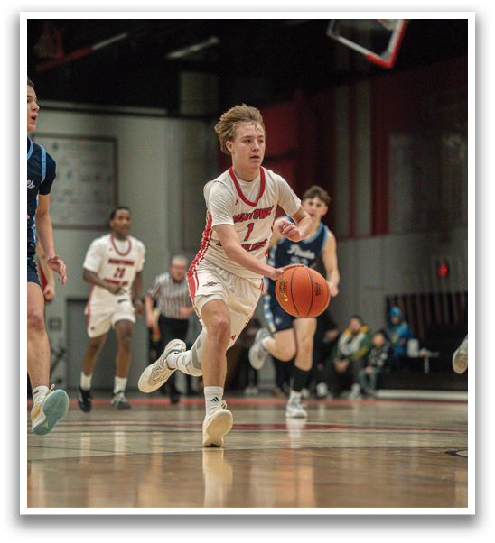 A basketball player is running with the ball, while other players chase him. AI generated content