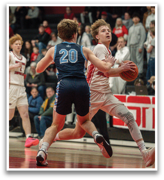 A basketball game is in progress with players running on the court. A man in a white shirt is holding a basketball. AI generated content