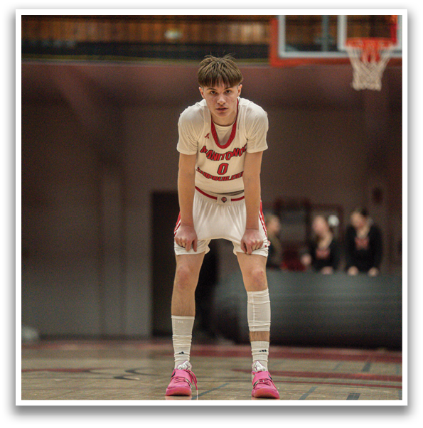 A basketball player is standing on the court with his hands on his knees. AI generated content