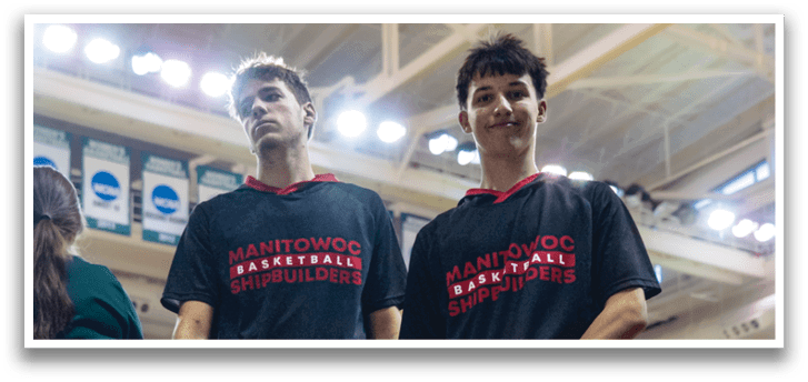 Two men wearing black shirts and white shorts are walking on a basketball court. AI generated content
