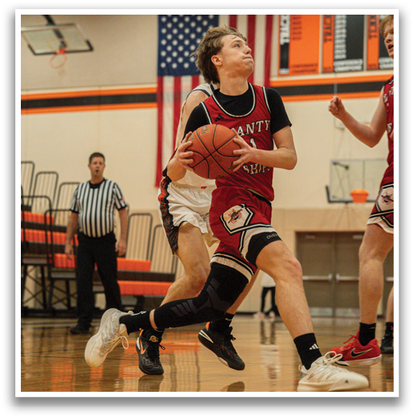 A basketball player in a red jersey is running with a basketball in his hand. AI generated content
