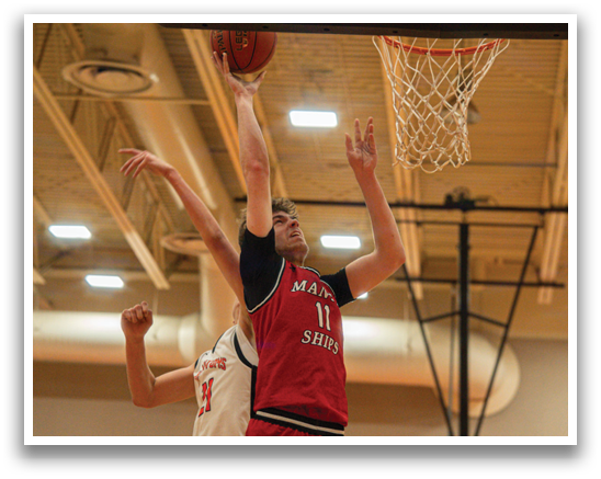 Two men are playing basketball, one of them jumping to hit the ball. AI generated content