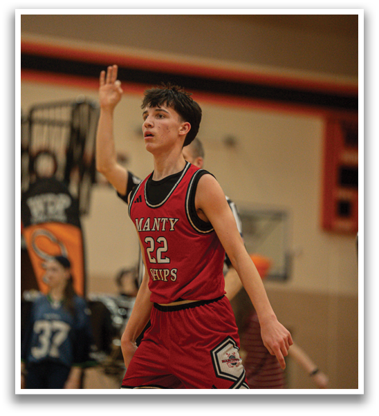 A man in a red jersey is holding up his hand, possibly signaling to his teammates. AI generated content