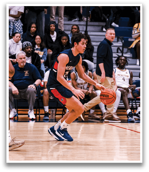 A basketball game is taking place with a group of people on the court. One player is holding a basketball while another player is running towards him. The crowd is watching the game intently. AI generated content