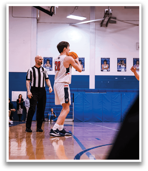 A basketball player is holding a ball in front of a referee and another player. AI generated content