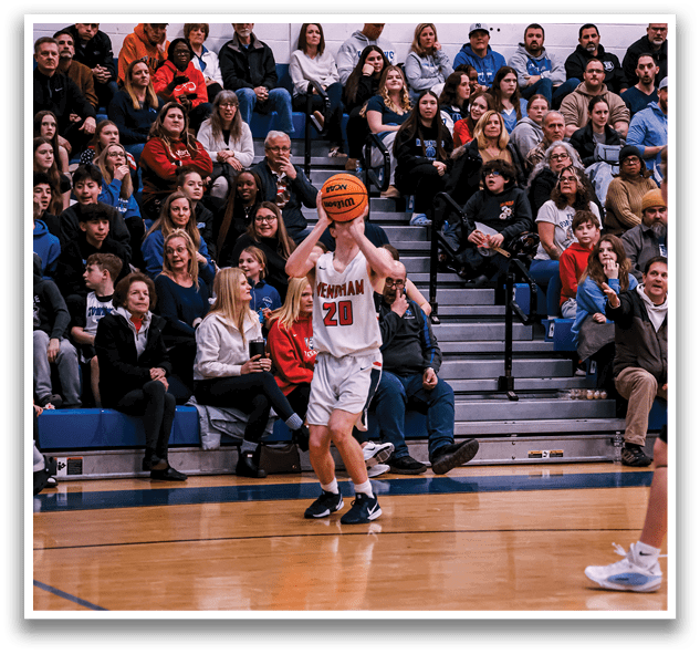A basketball player is holding a basketball in front of a crowd of people. AI generated content