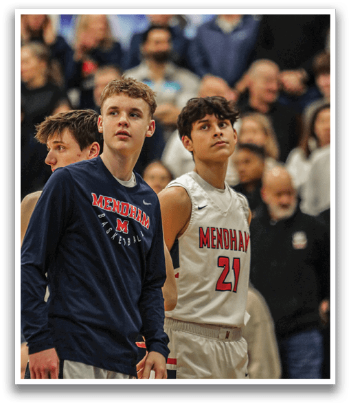 Two basketball players wearing blue and white uniforms stand on the court, looking at the crowd. AI generated content
